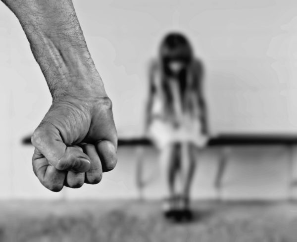 What is the difference between domestic assault and simple assault?